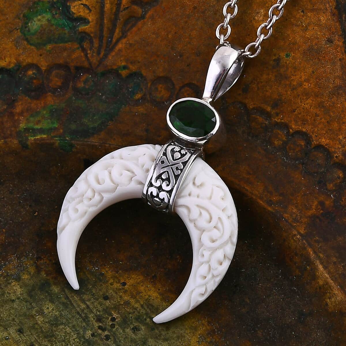 Bali Goddess Carved Bone and Chrome Diopside 1.25 ctw Crescent Moon Pendant in Sterling Silver image number 1