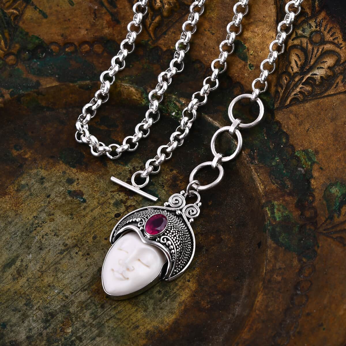 Bali Goddess Carved Bone and Niassa Ruby (FF) 1.20 ctw Necklace in Sterling Silver 18 Inches image number 1