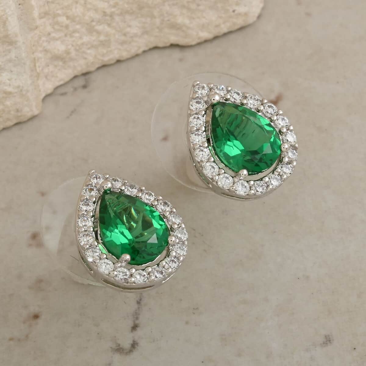 Simulated Emerald and Simulated Diamond 2.65 ctw Earrings in Silvertone image number 1