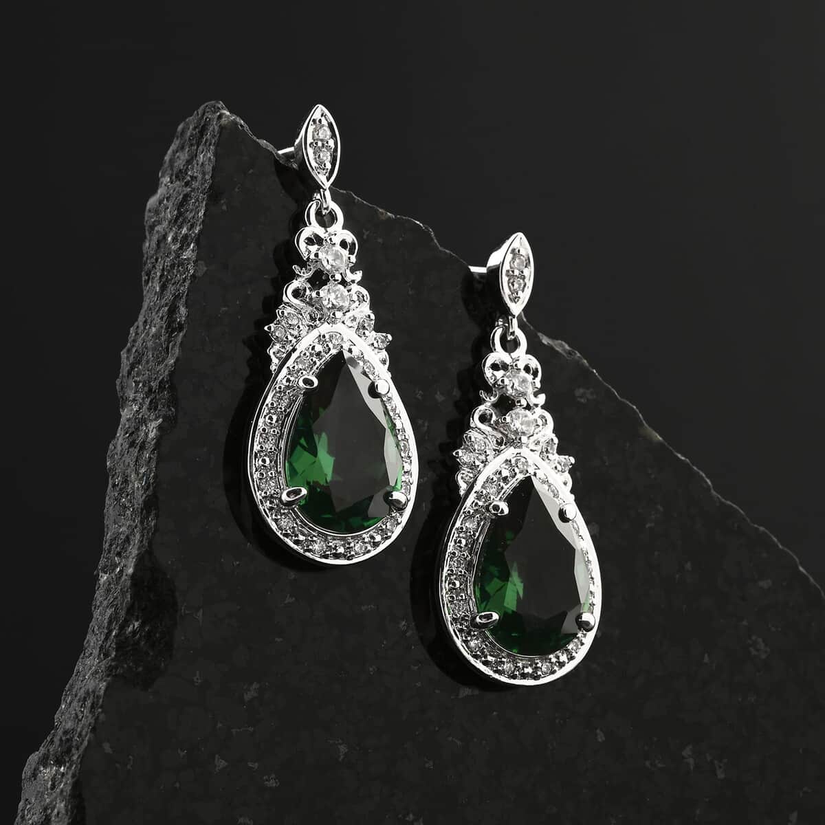 Simulated Emerald and Simulated Diamond 6.20 ctw Earrings in Silvertone image number 1