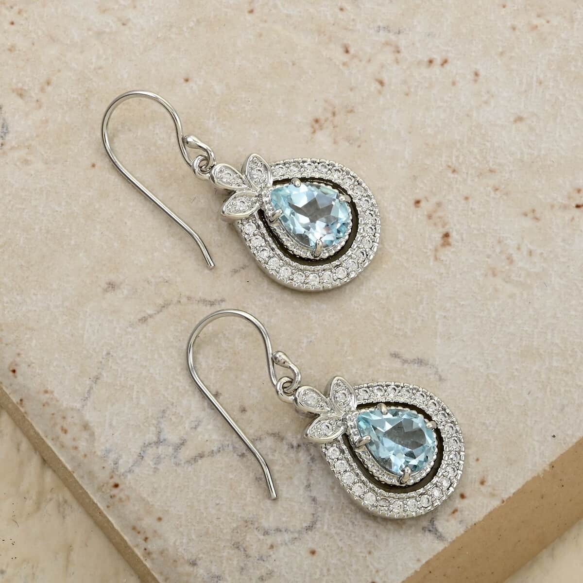 Blue Topaz and Simulated Diamond 4.50 ctw Earrings in Silvertone image number 1