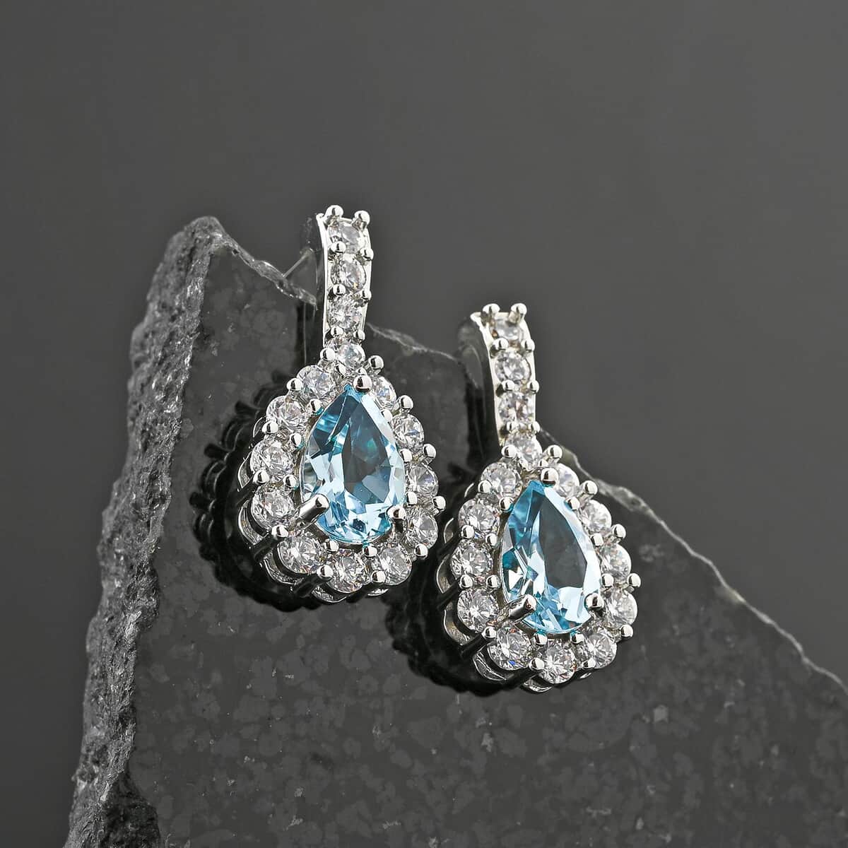 Blue Topaz and Simulated Diamond 5.80 ctw Earrings in Silvertone image number 1