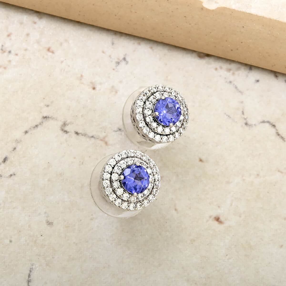 Simulated Tanzanite and Simulated Diamond 1.40 ctw Earrings in Silvertone image number 1