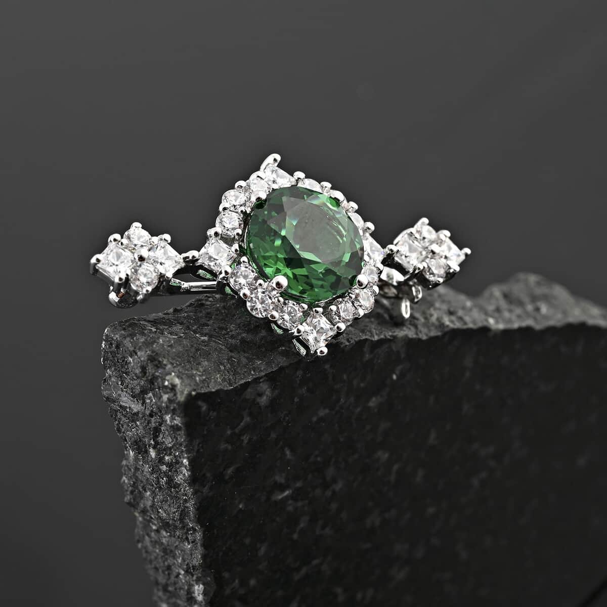 Simulated Emerald Color Diamond and Simulated Diamond 4.70 ctw Brooch in Silvertone image number 1