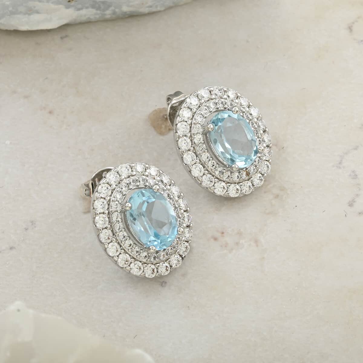 Blue Topaz and Simulated Diamond 3.85 ctw Earrings in Silvertone image number 1