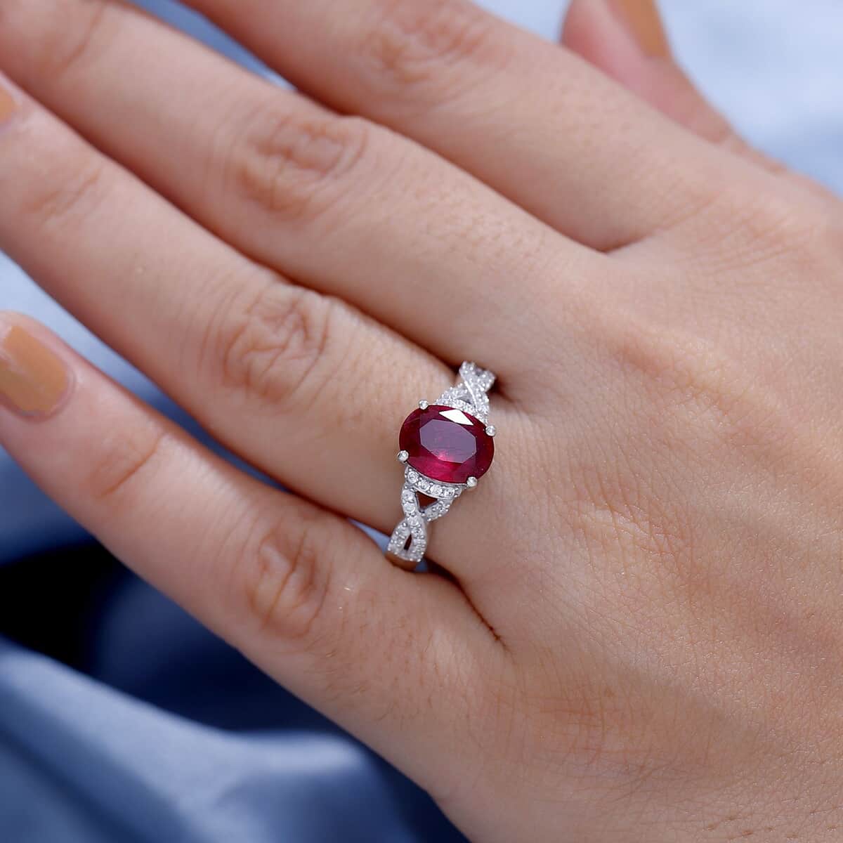 Premium Niassa Ruby (FF) and White Zircon 3.00 ctw Infinity Ring in Rhodium Over Sterling Silver (Size 7.0) image number 2