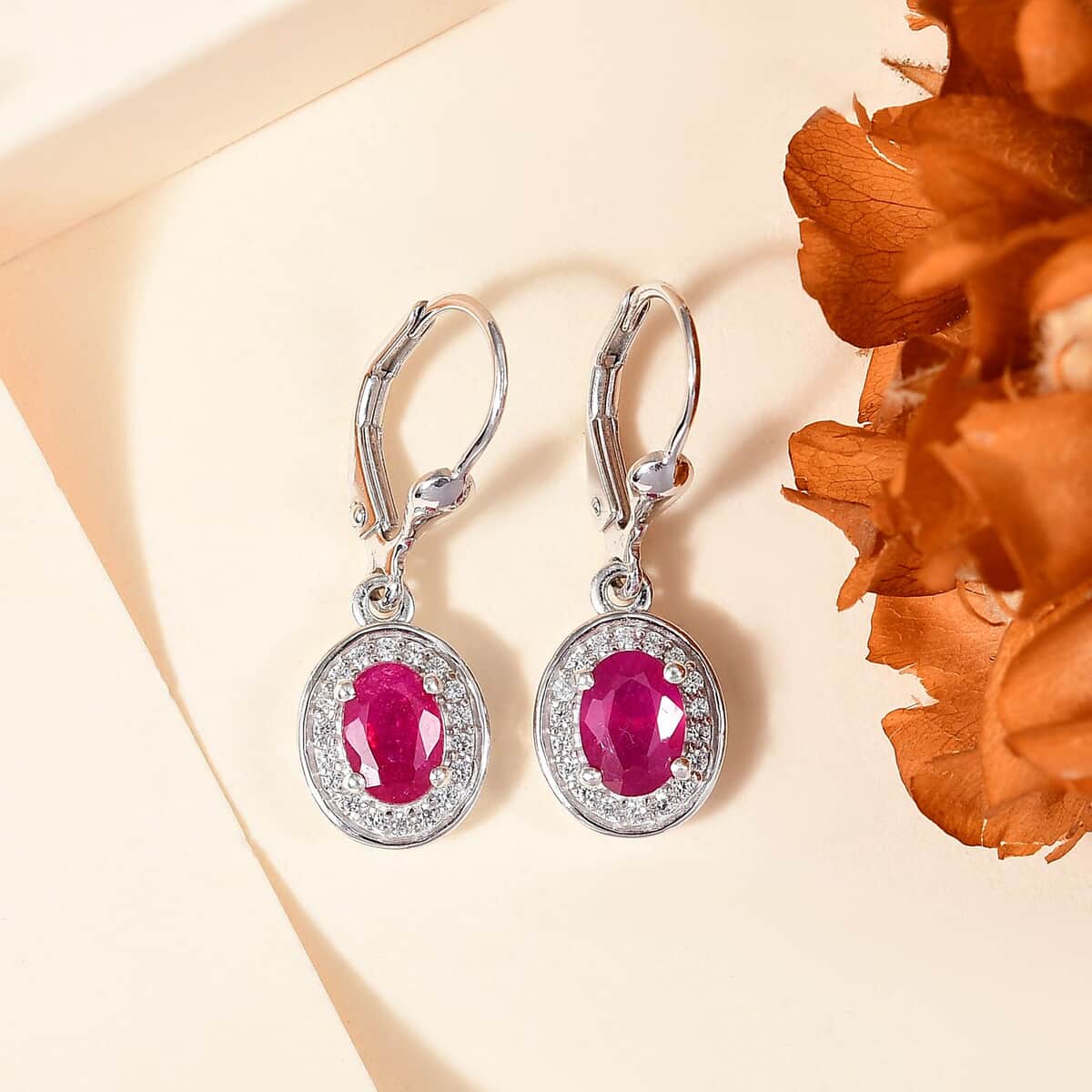 Premium Niassa Ruby (FF) and White Zircon 2.75 ctw Sunburst Earrings in Rhodium Over Sterling Silver image number 1