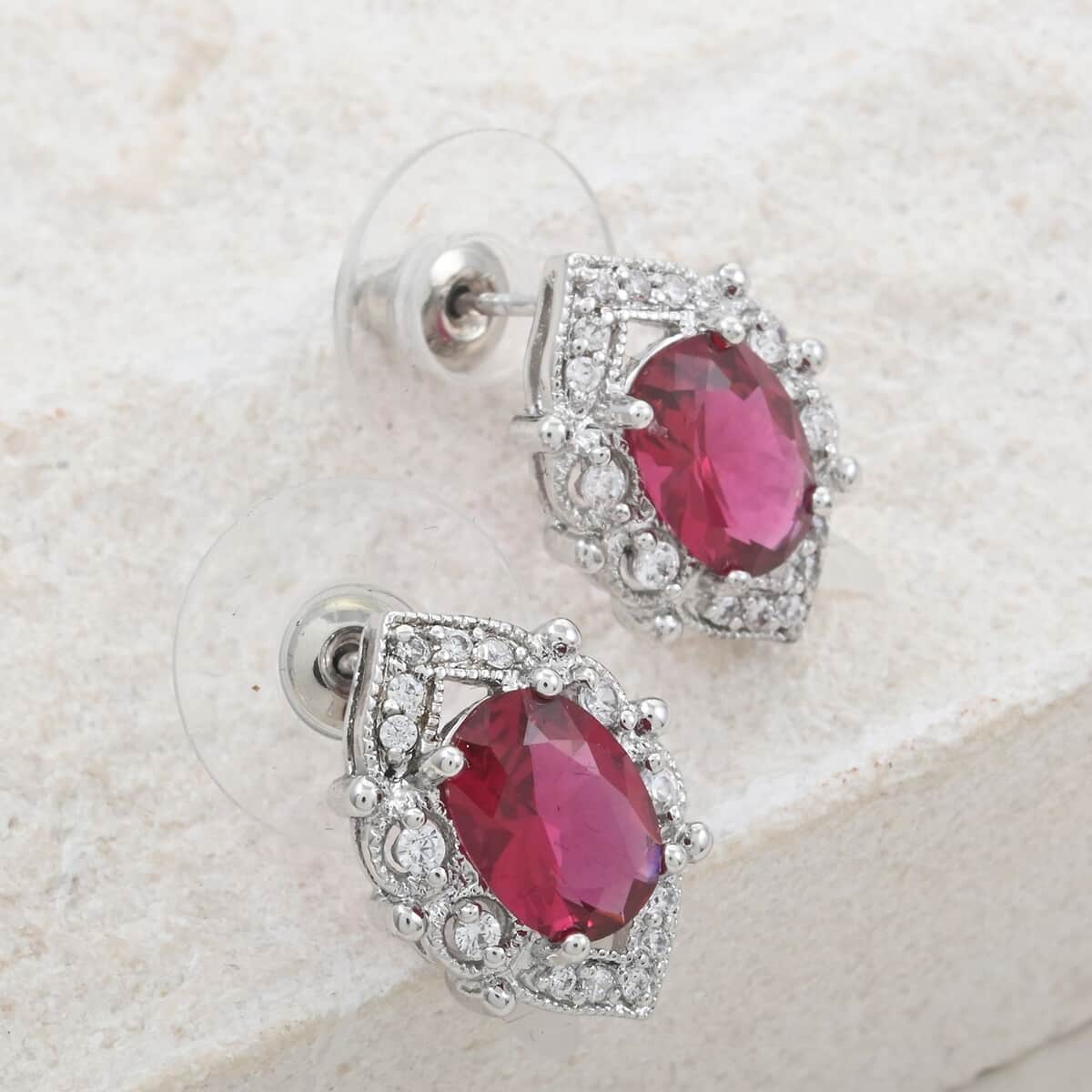 Ruby and Simulated Diamond 3.60 ctw Earrings in Silvertone image number 1