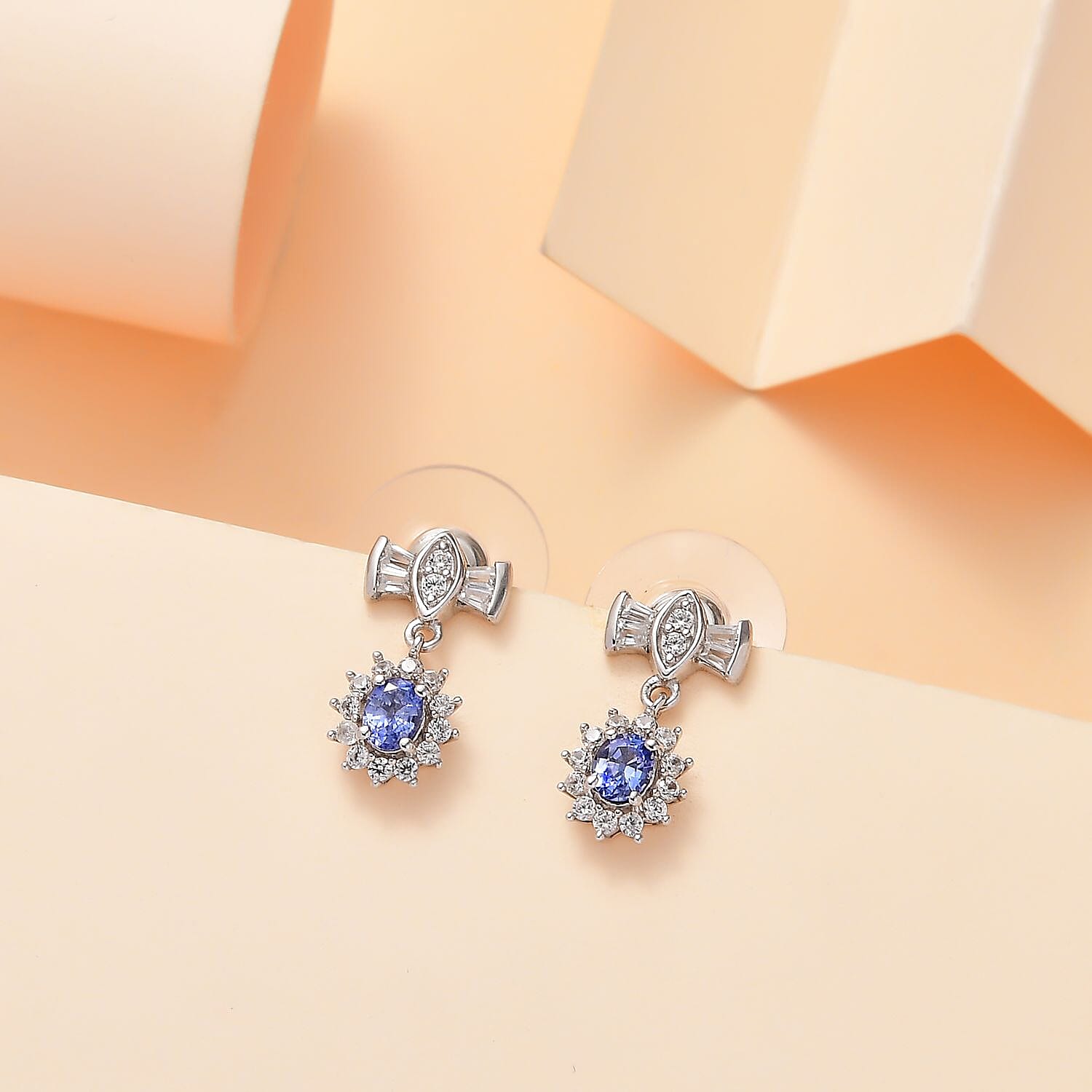 D'Joy Ceylon Blue Sapphire and White Zircon 1.20 ctw Bow Earrings in Rhodium Over Sterling Silver