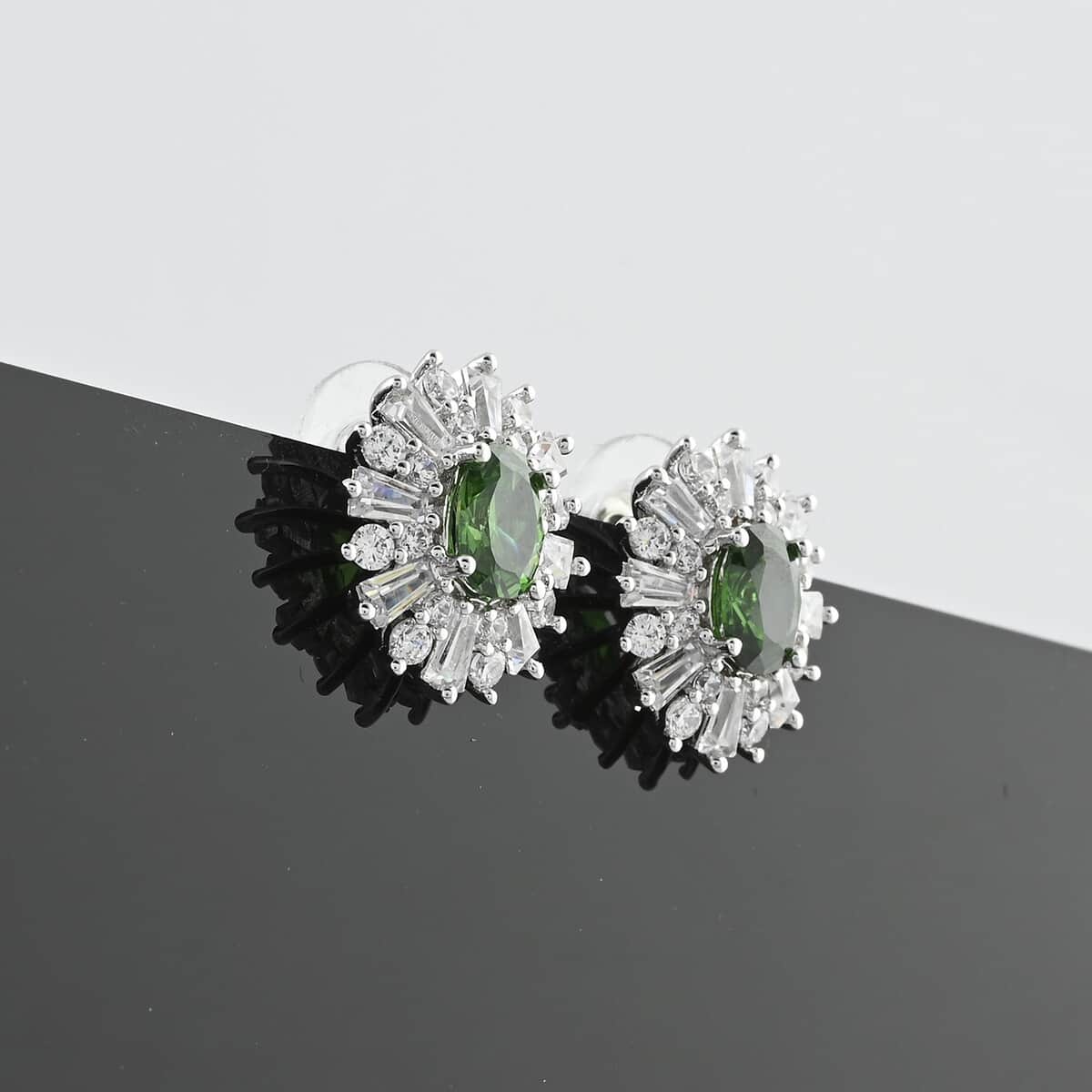 Simulated Emerald and Simulated Diamond 6.65 ctw Earrings in Silvertone image number 1