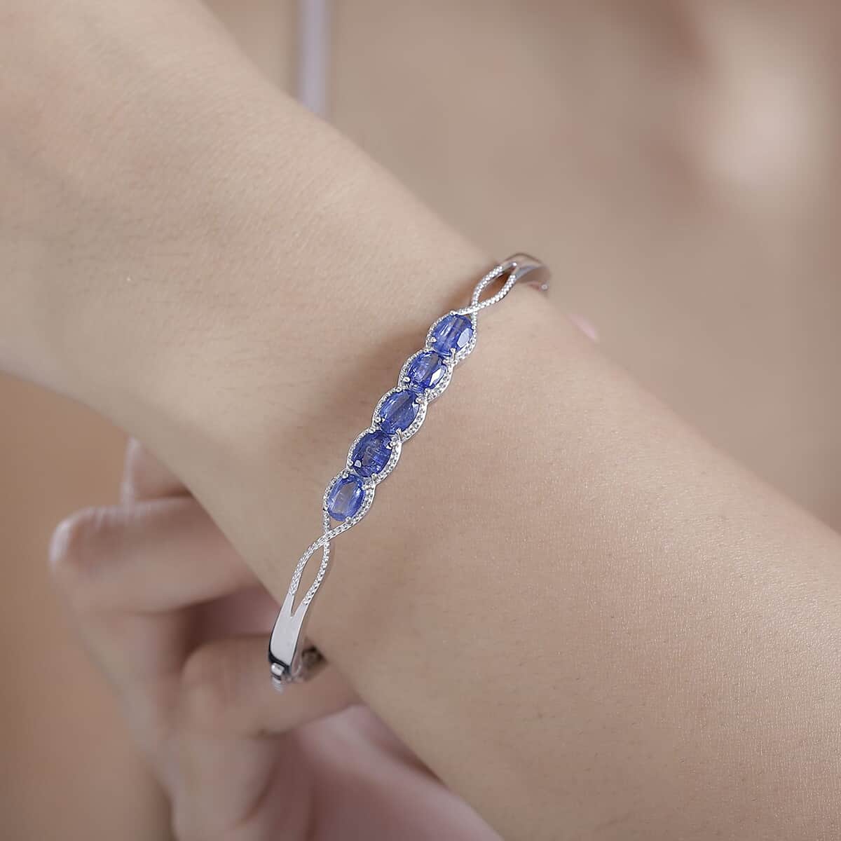 Kashmir Kyanite 4.90 ctw Love Infinity Bangle Bracelet in Rhodium Over Sterling Silver (7.25 In)  image number 2