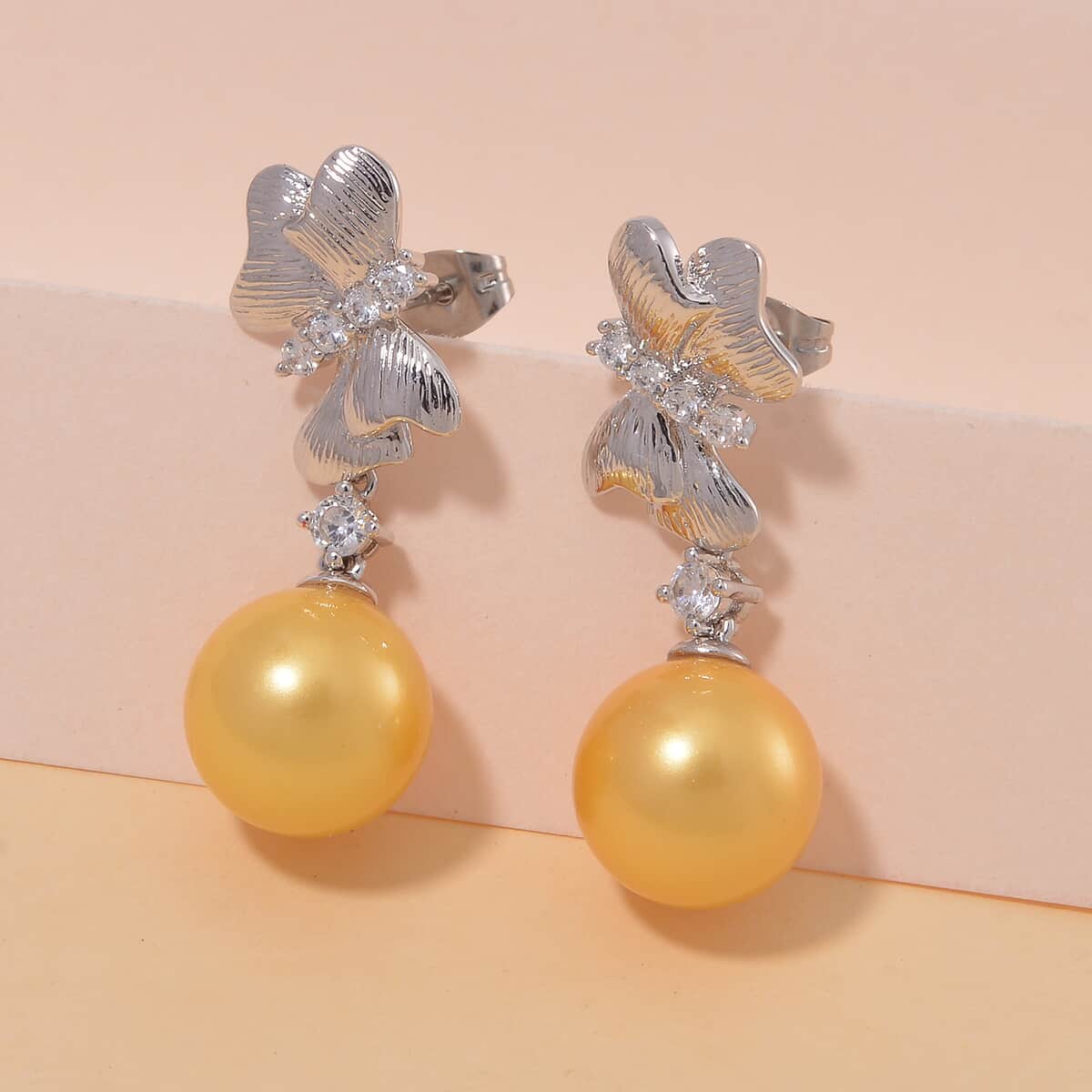 Golden Shell Pearl and Simulated Diamond 0.80 ctw Earrings in Silvertone with Steel Push Back image number 1