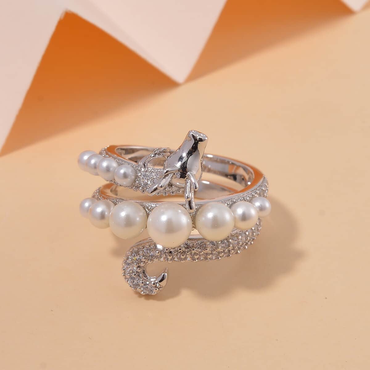 White Shell Pearl and Simulated Diamond 1.25 ctw Dragon Ring in Silvertone image number 1