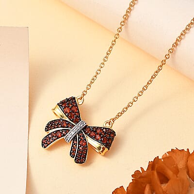 Karis Mozambique Garnet and White Zircon 1.60 ctw Bow Knot Necklace in 18K Yellow Gold Plated with ION Plated YG Steel Chain 18 Inches