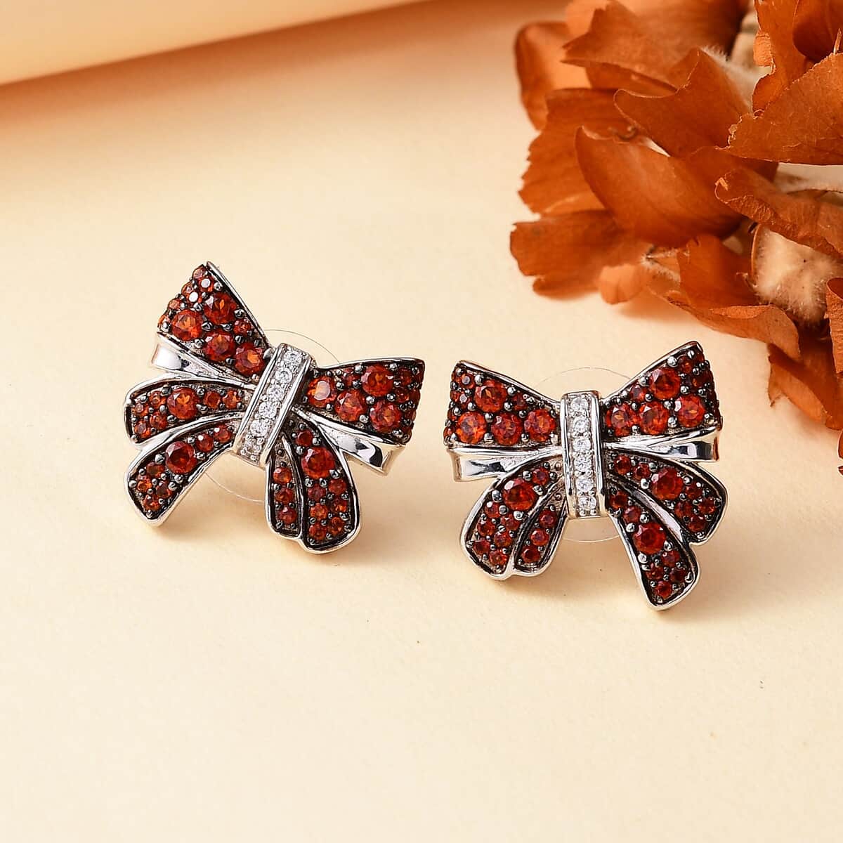 Karis Mozambique Garnet and White Zircon 2.30 ctw Bow Knot Earrings in Platinum Bond image number 1