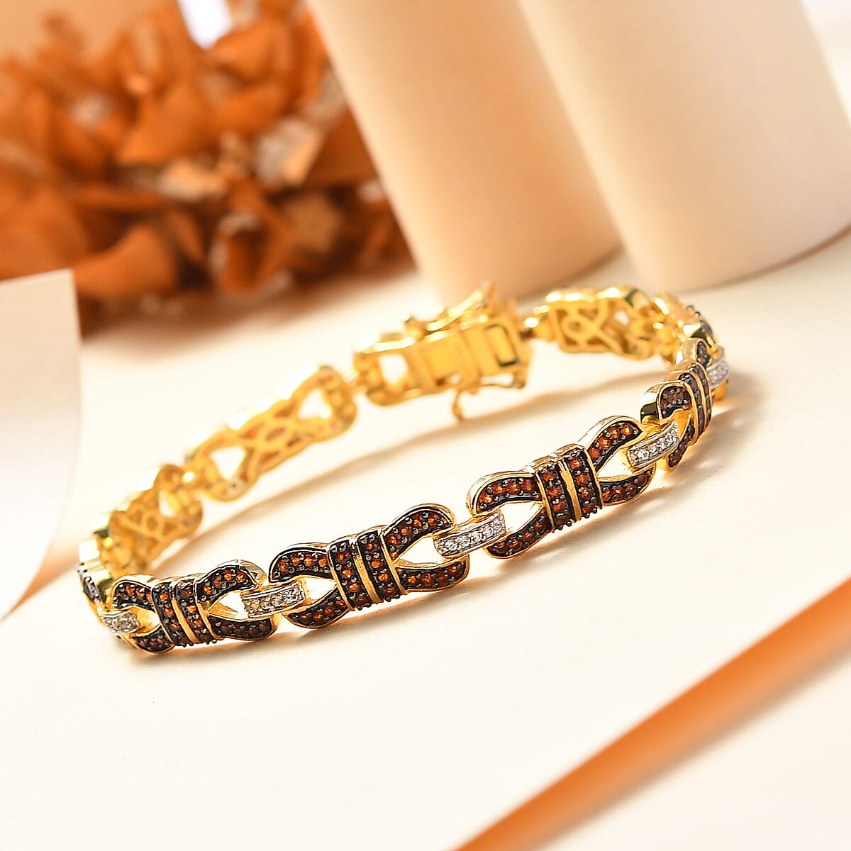 Karis Mozambique Garnet and White Zircon 3.15 ctw Bow Knot Bracelet in 18K Yellow Gold Plate (8.00 In) image number 1