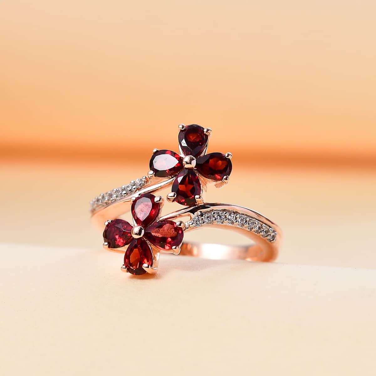 Premium Anthill Garnet and White Zircon 1.65 ctw Bypass Floral Ring in 18K Vermeil Rose Gold Over Sterling Silver (Size 10.0) image number 1