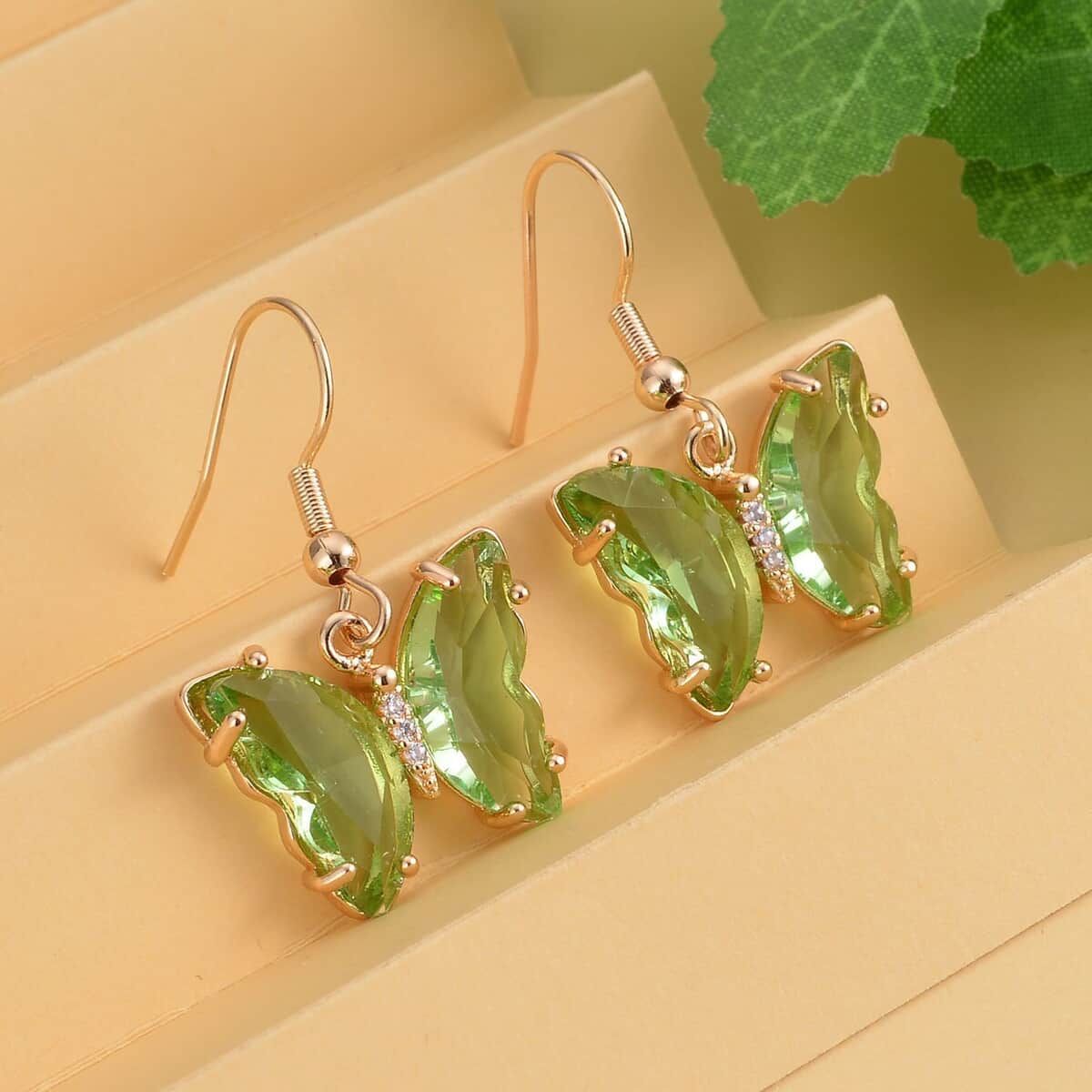 Simulated Light Green Sapphire and Simulated Diamond Butterfly Earrings in Goldtone 0.10 ctw image number 1