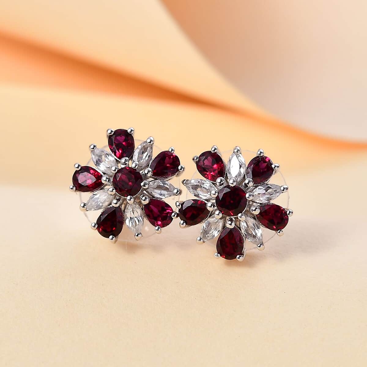 Premium Anthill Garnet and White Zircon 3.40 ctw Floral Earrings in Rhodium Over Sterling Silver image number 1