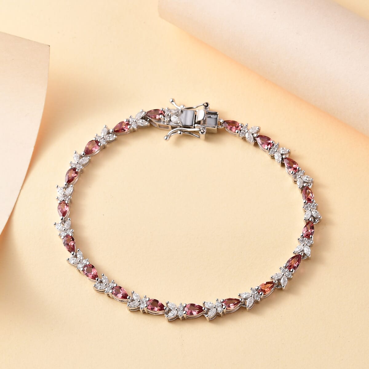 Premium Tanzanian Blush Garnet and Moissanite 6.50 ctw Butterfly Bracelet in Rhodium Over Sterling Silver (6.50 In) image number 1