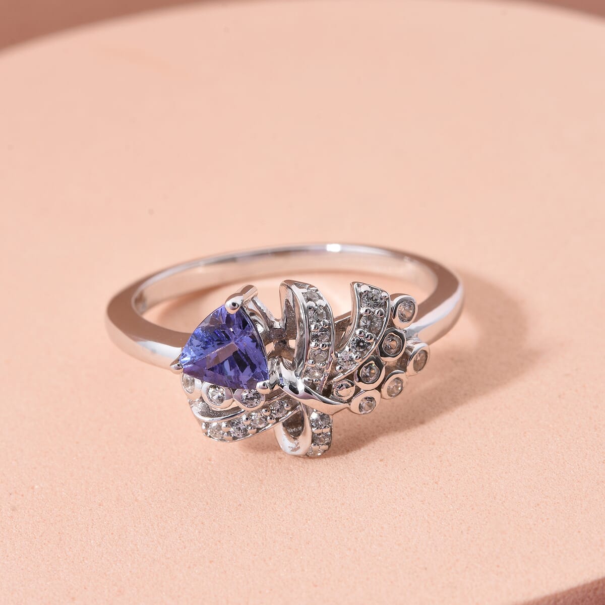 Tanzanite and White Zircon 0.65 ctw Love Knot Ring in Rhodium Over Sterling Silver (Size 8.0) image number 1