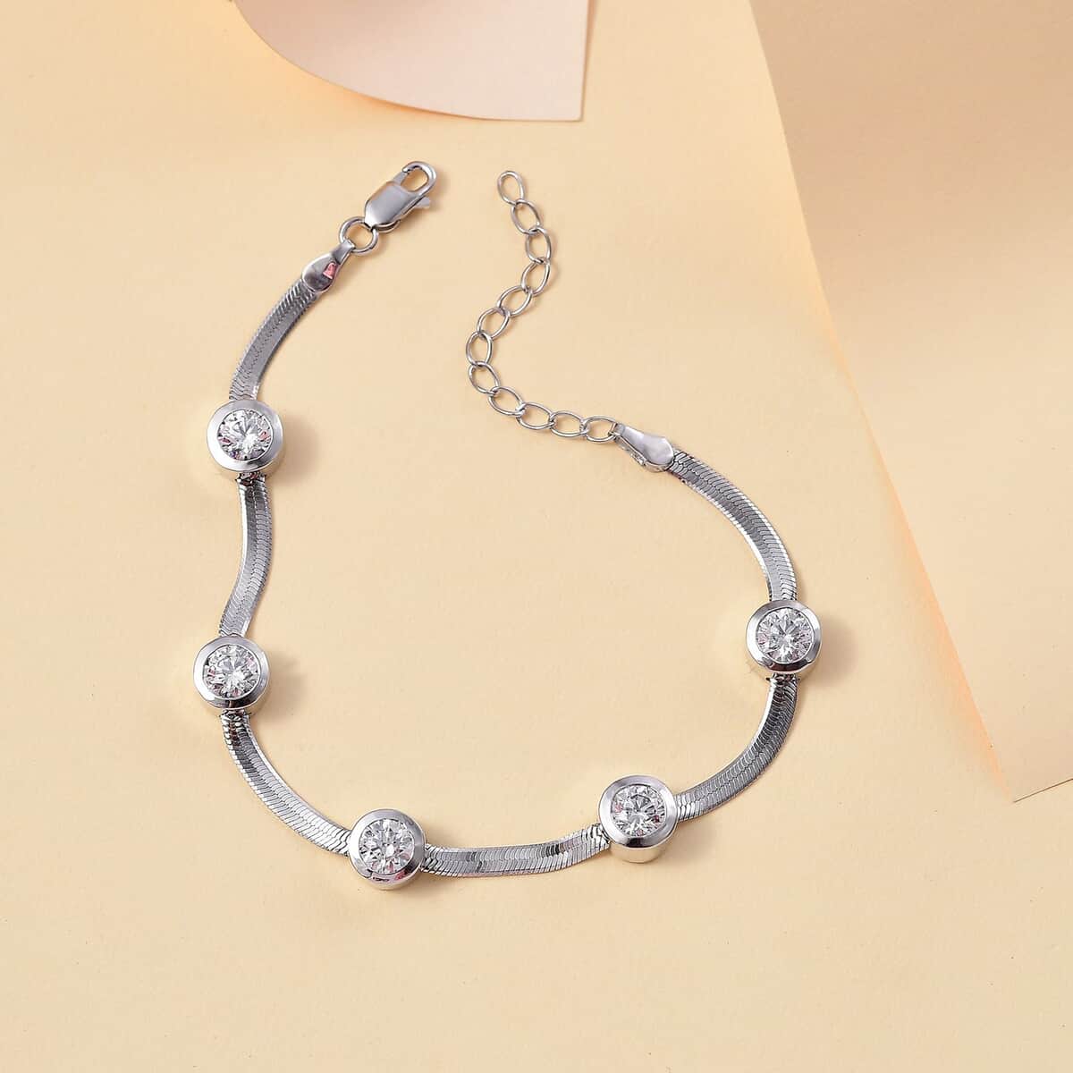 J Francis Embellished with Zirconia by Swarovski 7.40 ctw Herringbone Chain Station Bracelet in Rhodium Over Sterling Silver (6.50-8.00In) image number 1