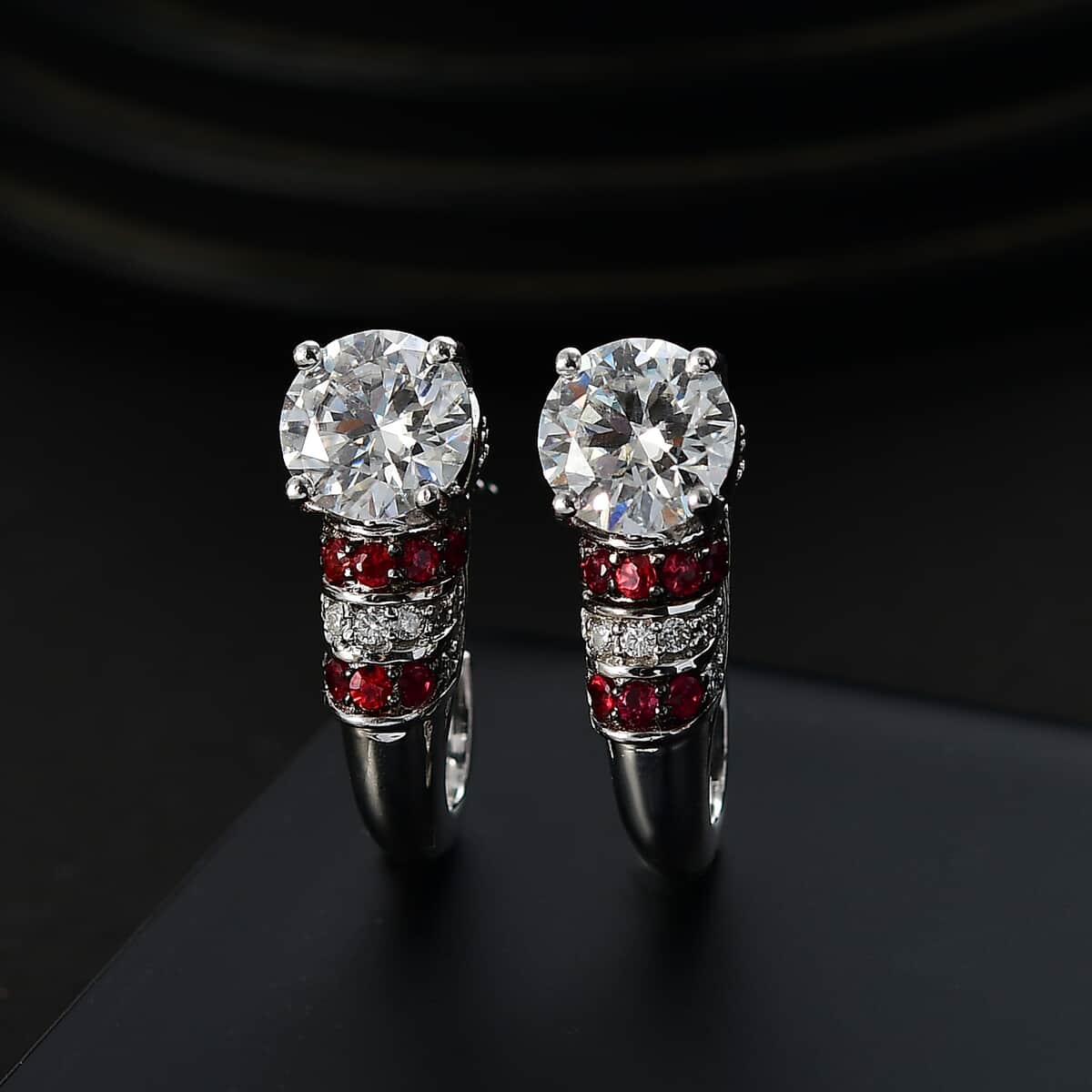 Moissanite and Red Sapphire 2.90 ctw Moonlit Grace Earrings in Rhodium Over Sterling Silver image number 1