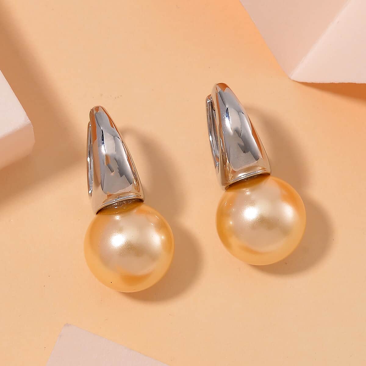 Golden Color Shell Pearl Earrings in Silvertone image number 1