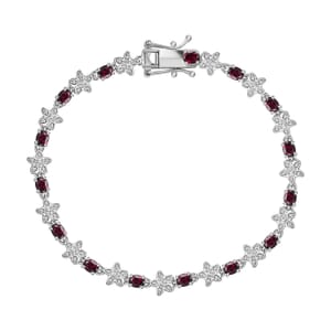 Premium Anthill Garnet and Moissanite 5.30 ctw Flower Bracelet in Rhodium Over Sterling Silver (7.25 In)
