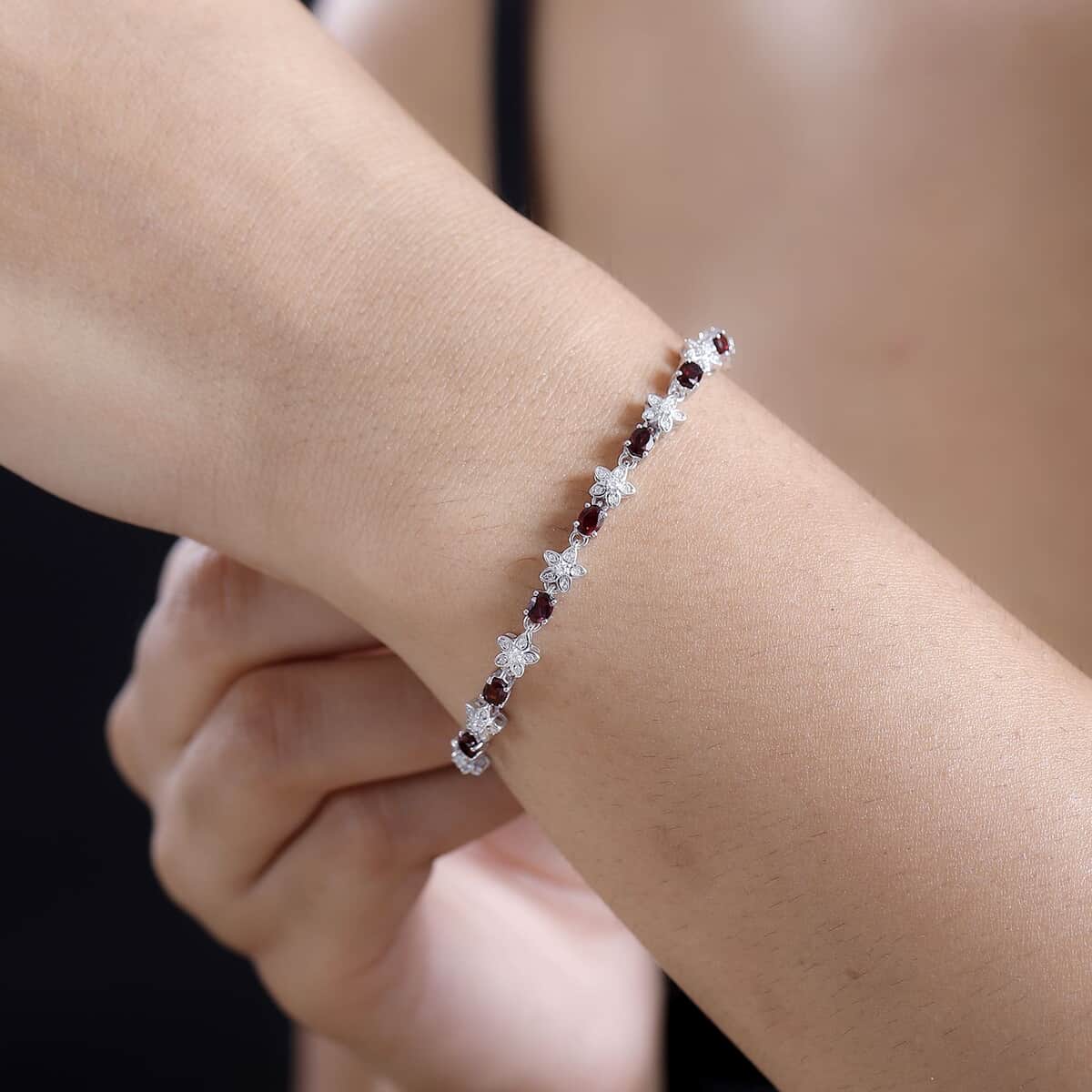 Premium Anthill Garnet and Moissanite 5.30 ctw Flower Bracelet in Rhodium Over Sterling Silver (7.25 In) image number 2