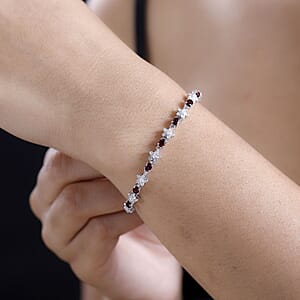 D'Joy Premium Anthill Garnet and Moissanite 5.30 ctw Flower Bracelet in Rhodium Over Sterling Silver (7.25 In)