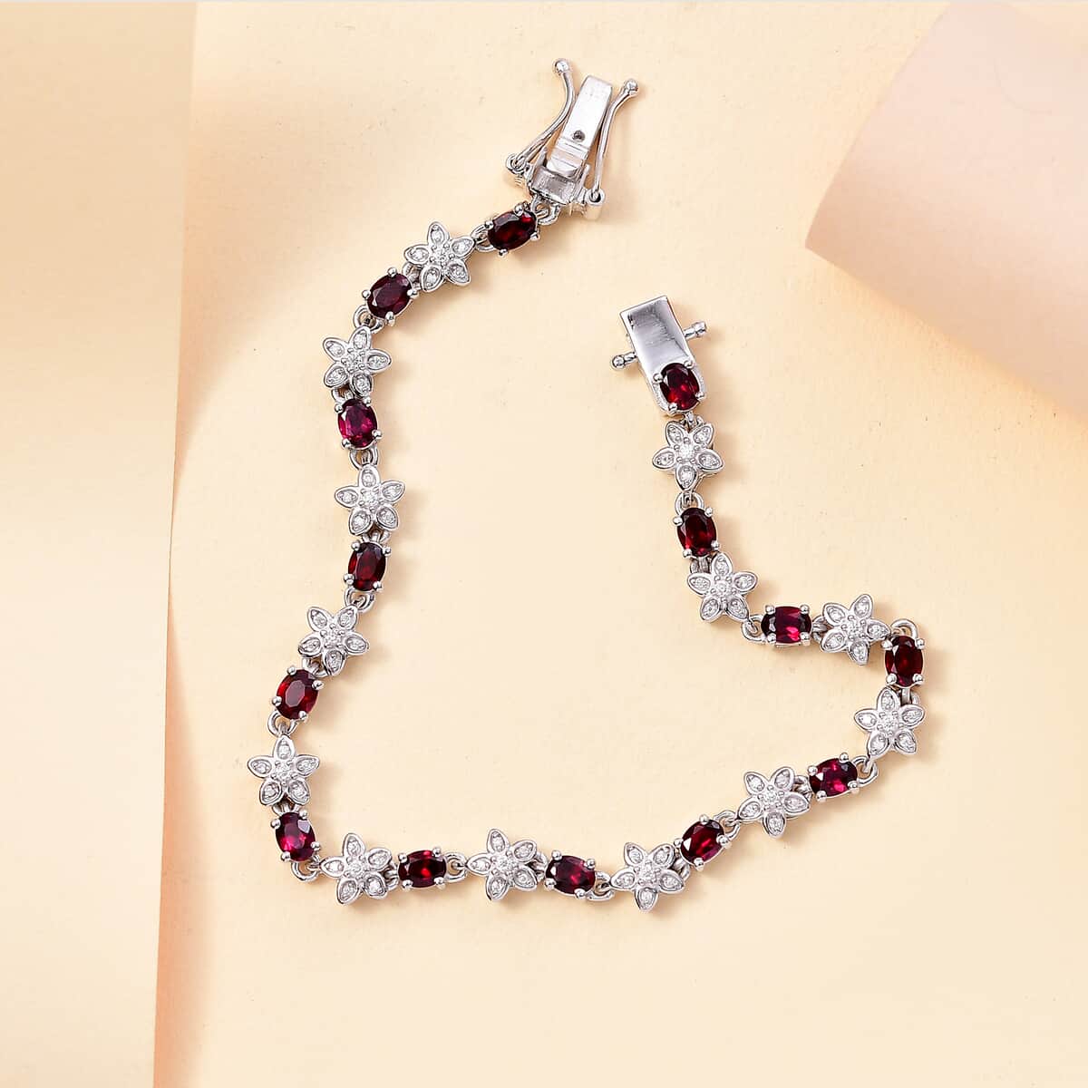 Premium Anthill Garnet and Moissanite 6.00 ctw Flower Bracelet in Rhodium Over Sterling Silver (8.00 In) image number 1