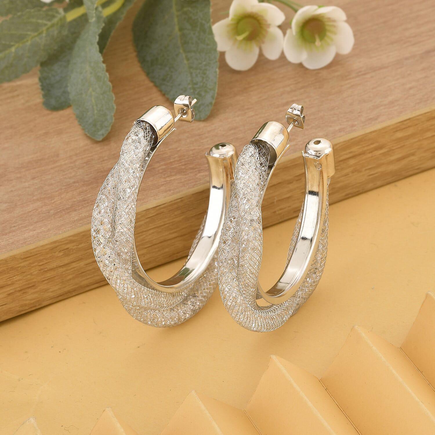 White Austrian Crystal Twisted Half Hoop Earrings in Silvertone