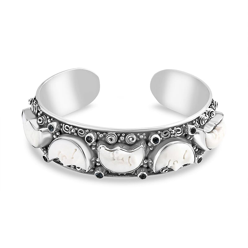 Bali Legacy Carved Bone and Blue Topaz 1.20 ctw Moon Cuff Bracelet in Sterling Silver (8.00In)