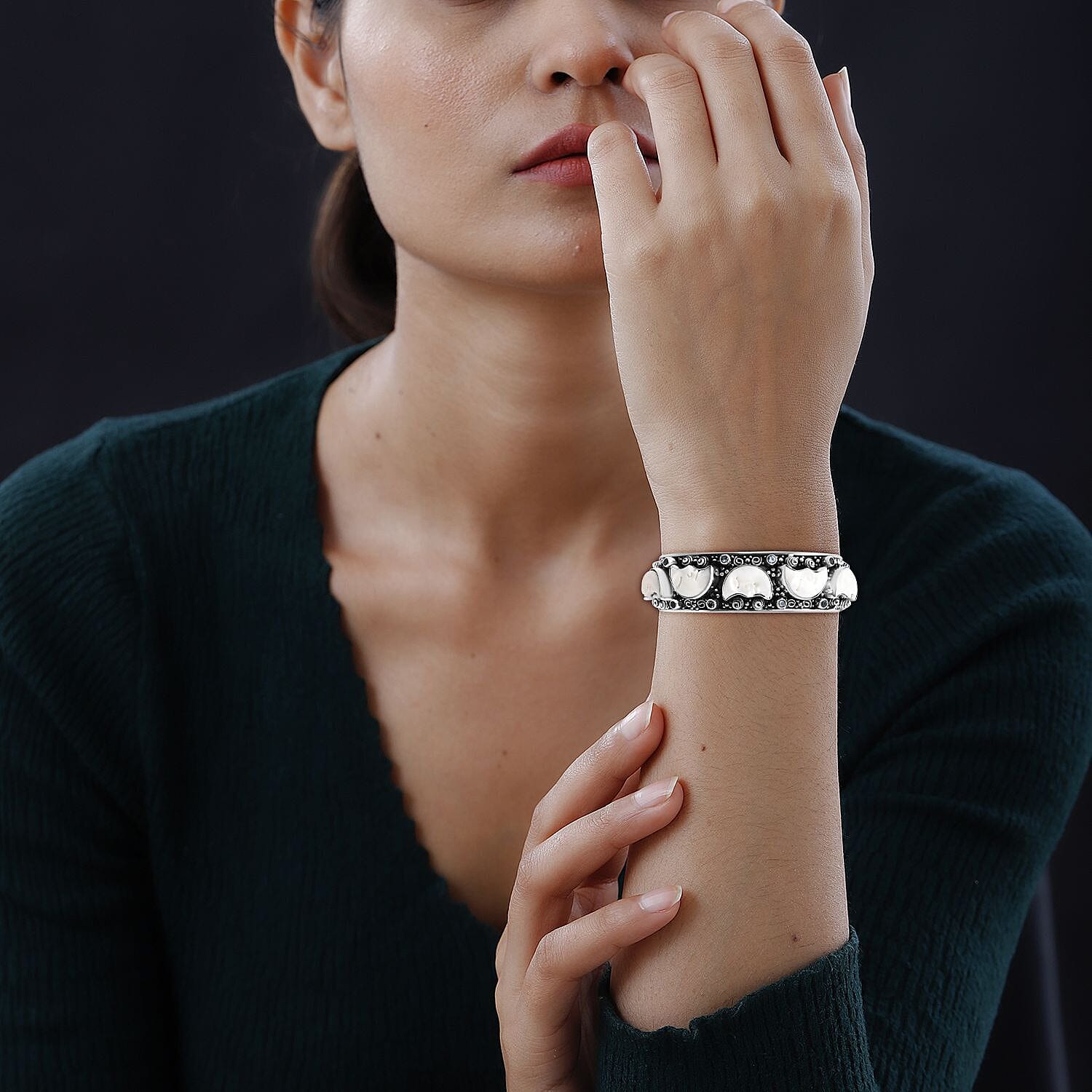 Bali Legacy Carved Bone and Blue Topaz 1.20 ctw Moon Cuff Bracelet in Sterling Silver (8.00In)