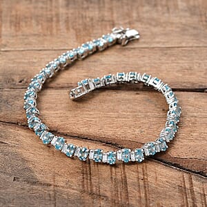 D'Joy Premium Cambodian Blue Zircon and Moissanite 14.85 ctw Sea Wave Bracelet in Rhodium Over Sterling Silver (6.50 In) (Del. in 10-12 Days)