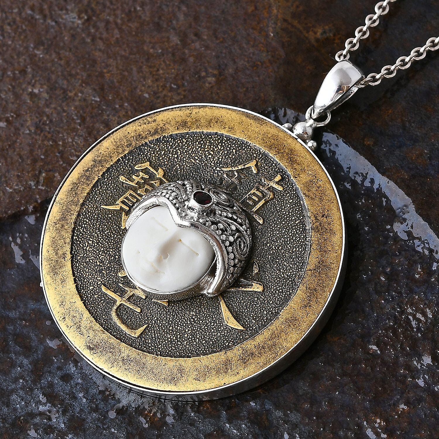 Sajen Silver Carved Bone, Mozambique Garnet 0.15 ctw, Coin Pendant without Chain in Sterling Silver