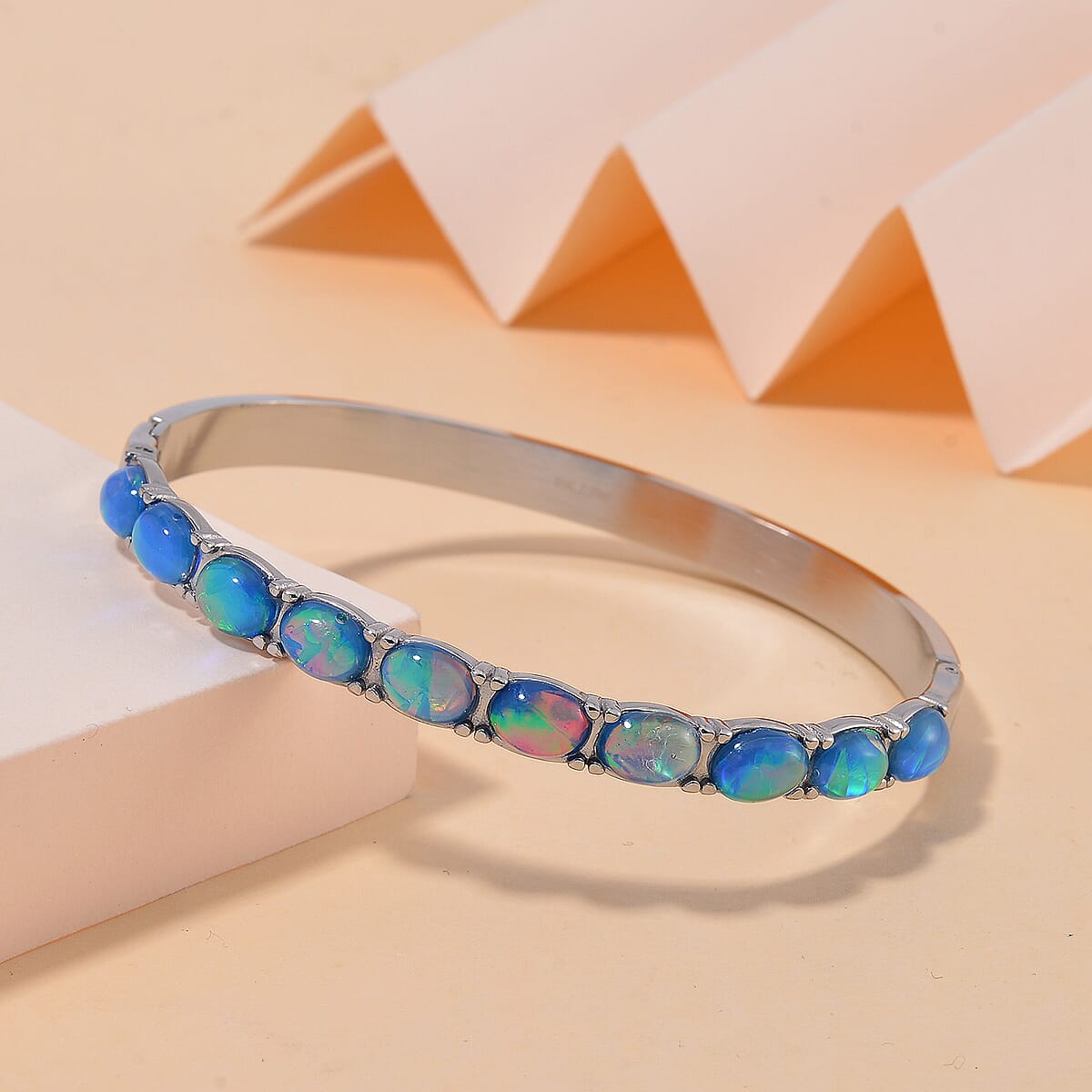 Blue Magic Simulated Opal Resin Bangle Bracelet in Stainless Steel (7.50 In) image number 1