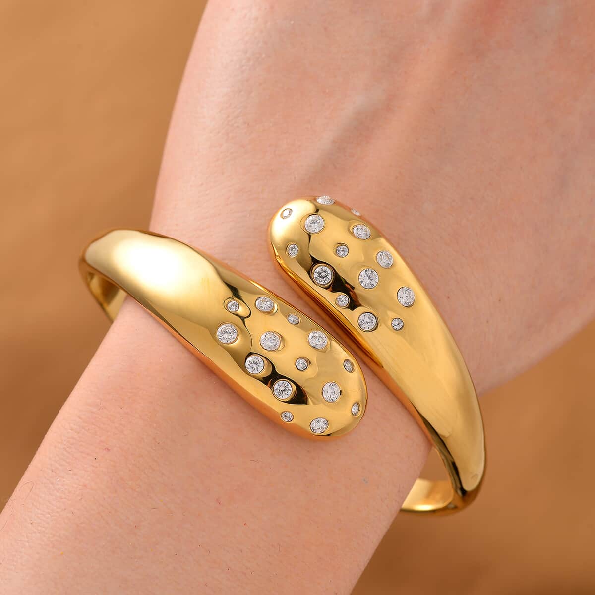 Simulated Diamond Bangle Bracelet in ION Plated Yellow Gold Stainless Steel (7.50 In) image number 1