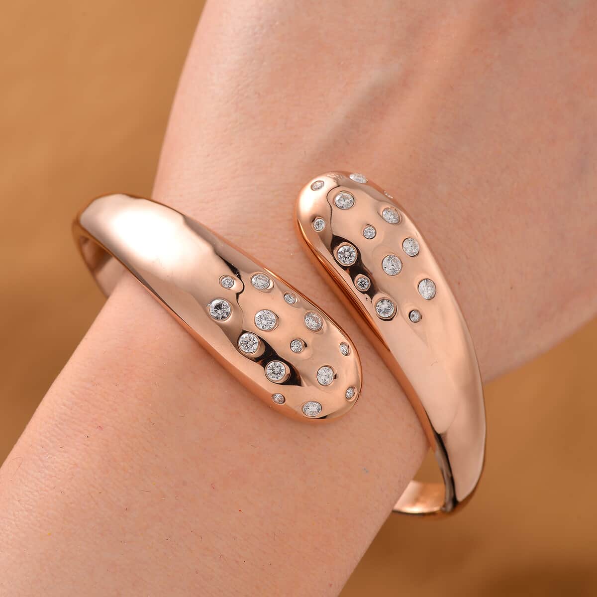 Simulated Diamond Bangle Bracelet in ION Plated Rose Gold Stainless Steel (7.50 In) image number 1