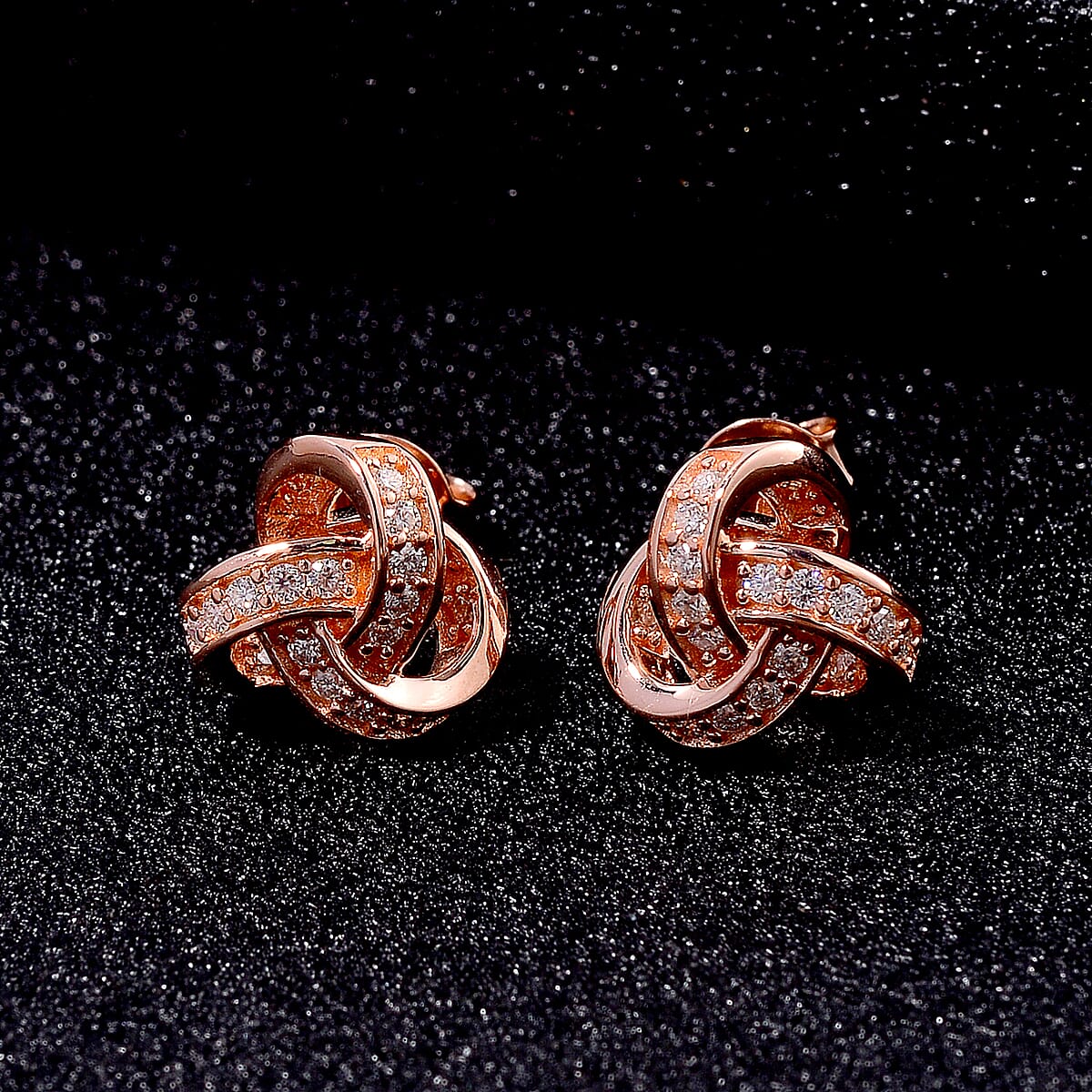 D'Joy Moissanite 0.35 ctw Knot Stud Earrings in Vermeil Rose Gold Over Sterling Silver image number 1