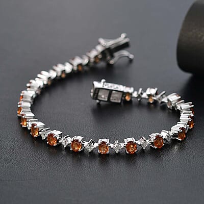 D'Joy Ceylon Hessonite Garnet and Moissanite 5.40 ctw Bracelet in Rhodium Over Sterling Silver (6.50 In)