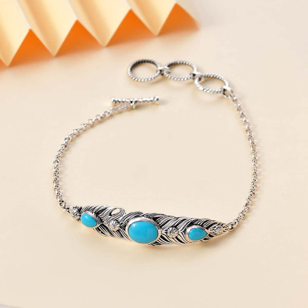 Artisan Crafted Sleeping Beauty Turquoise 2.60 ctw Feather Bracelet in Black Oxidized Sterling Silver (6.50-8.0In) image number 1