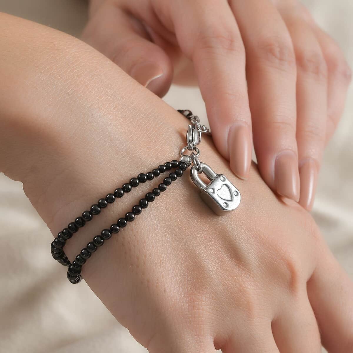 Thai Black Spinel 32.00 ctw Beaded Double Row Bracelet with Lock Charm in Stainless Steel (7.25-9.25In) image number 2