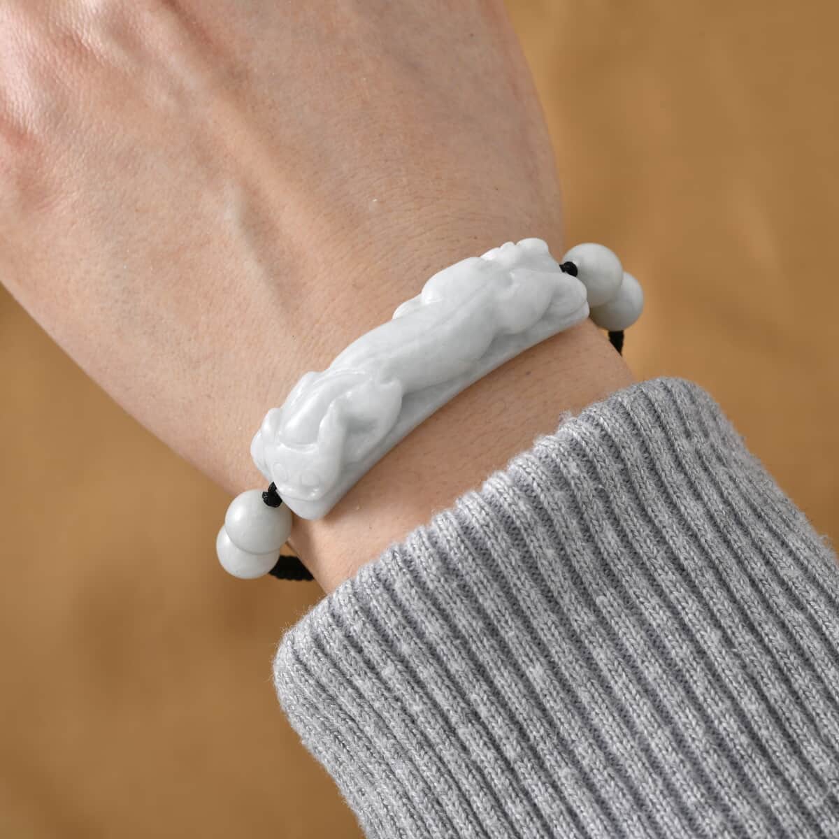 Natural Jade 110.00 ctw Carved Pixiu Bracelet in Rope Cord (6-9inch) image number 1