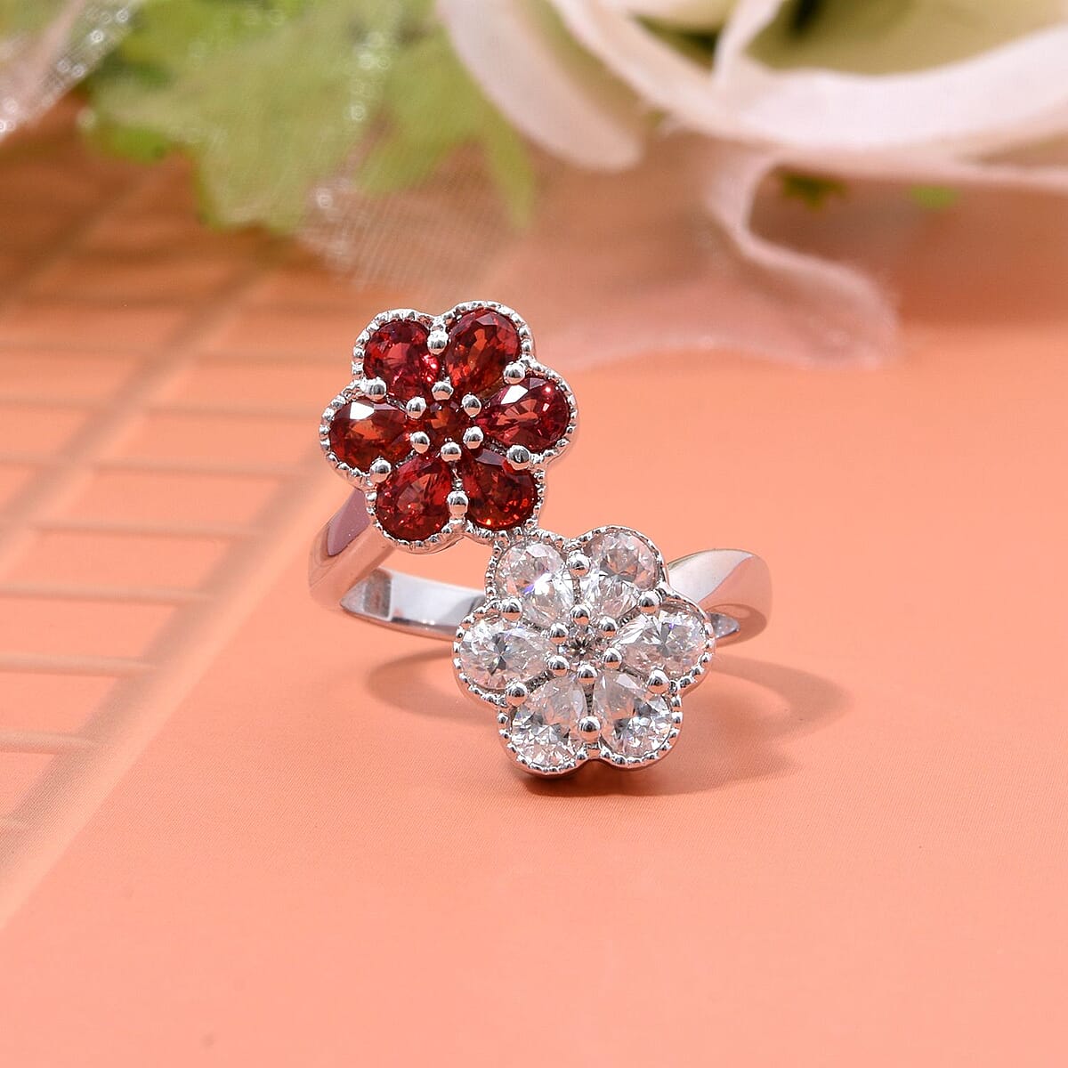 Premium Red Sapphire and Moissanite 2.30 ctw Bypass Flower Ring in Rhodium Over Sterling Silver (Size 7.0) image number 1