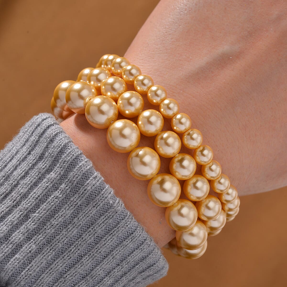 Golden Color Shell Pearl Three-Row Bracelet in Stainless Steel (7.50 In) image number 1