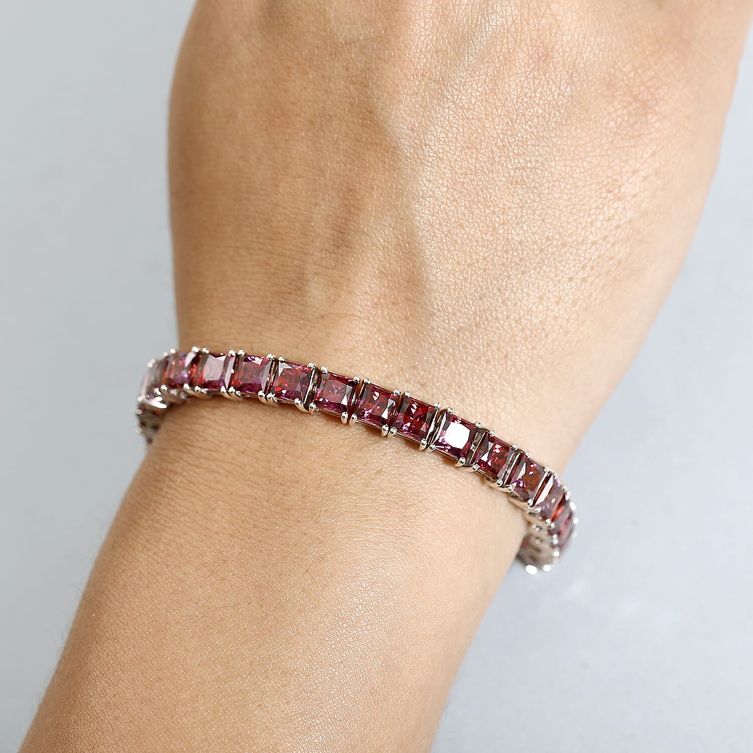 J Francis Embellished with Dark Red Zirconia by Swarovski 44.40 ctw Iconic Tennis Bracelet in Rhodium Over Sterling Silver (7.25 In)