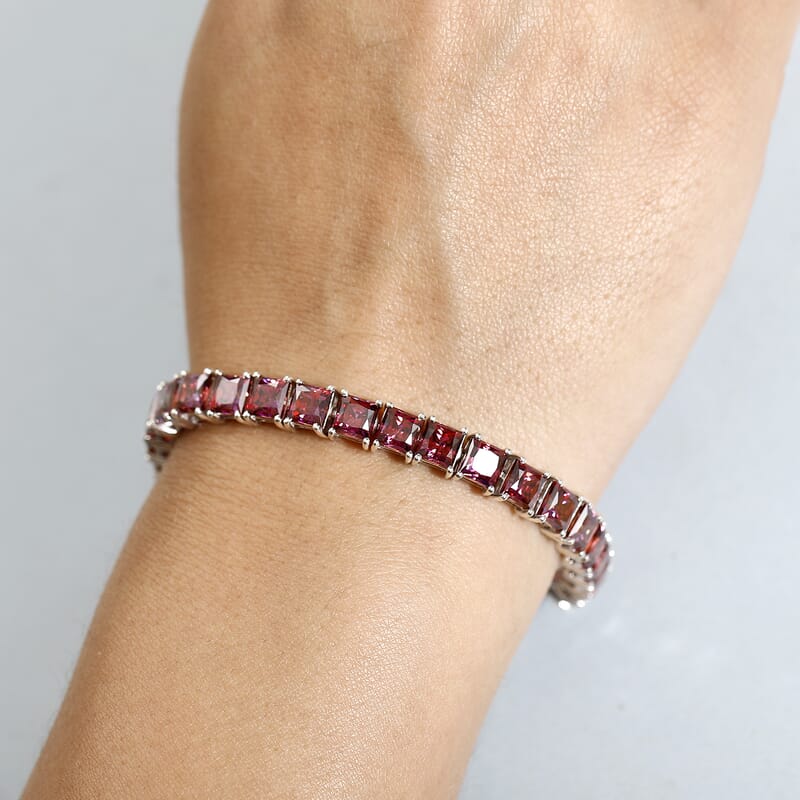 J Francis Embellished with Dark Red Zirconia by Swarovski 44.40 ctw Iconic Tennis Bracelet in Rhodium Over Sterling Silver (7.25 In)