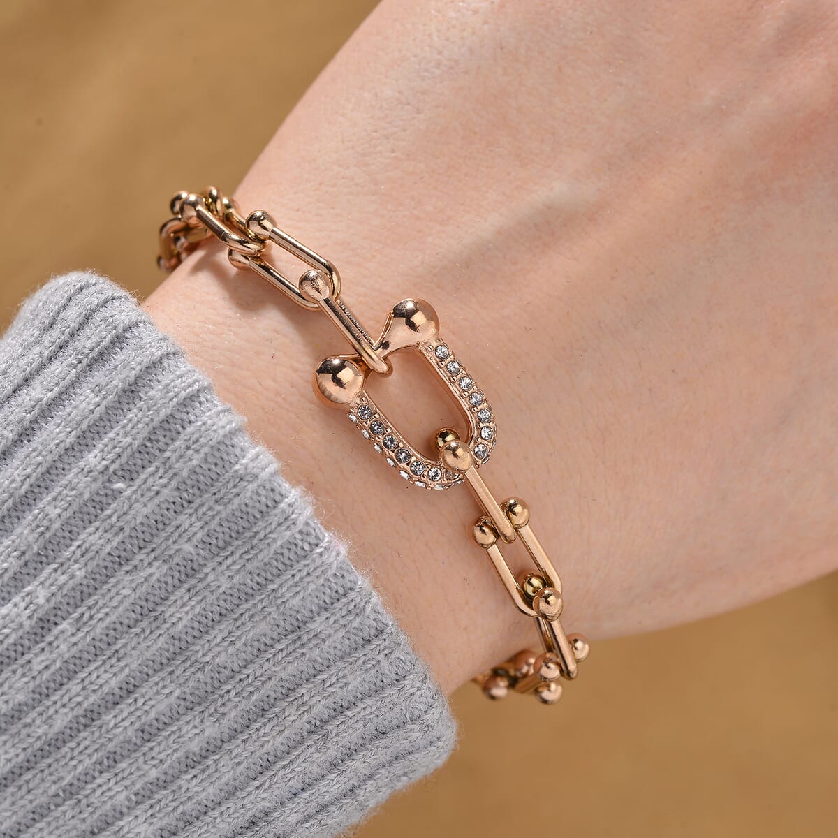 White Austrian Crystal U Link Horseshoe Bracelet in ION Plated RG Stainless Steel (7.5-9.5In) image number 1